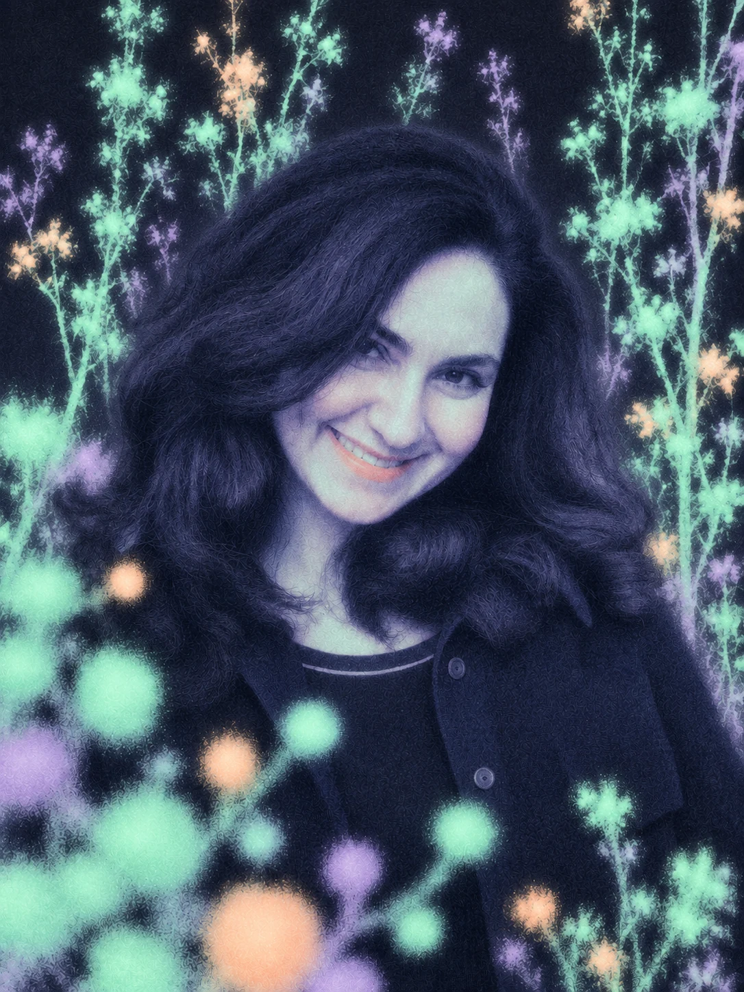 Saba smiling among glowing pastel flowers